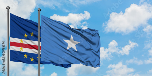 Cape Verde and Somalia flag waving in the wind against white cloudy blue sky together. Diplomacy concept, international relations.