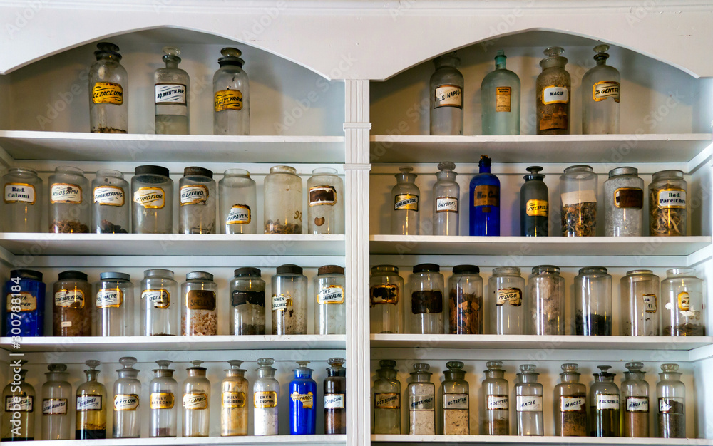 Fototapeta premium old medicine bottles on shelves