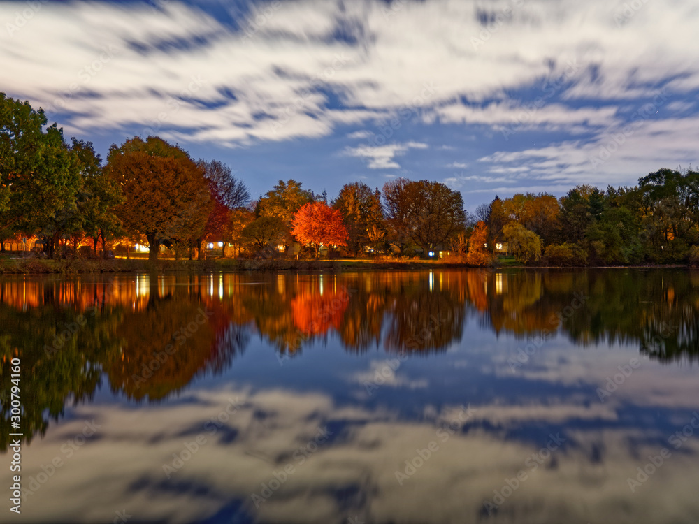Fototapeta premium reflection of trees on lake in autumn