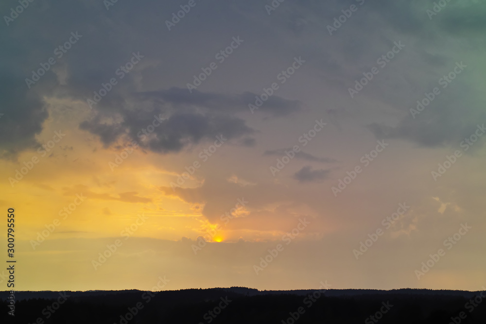 Bad weather front, thunderstorm, storm, heavy rain and black clouds, about silhouette of forest