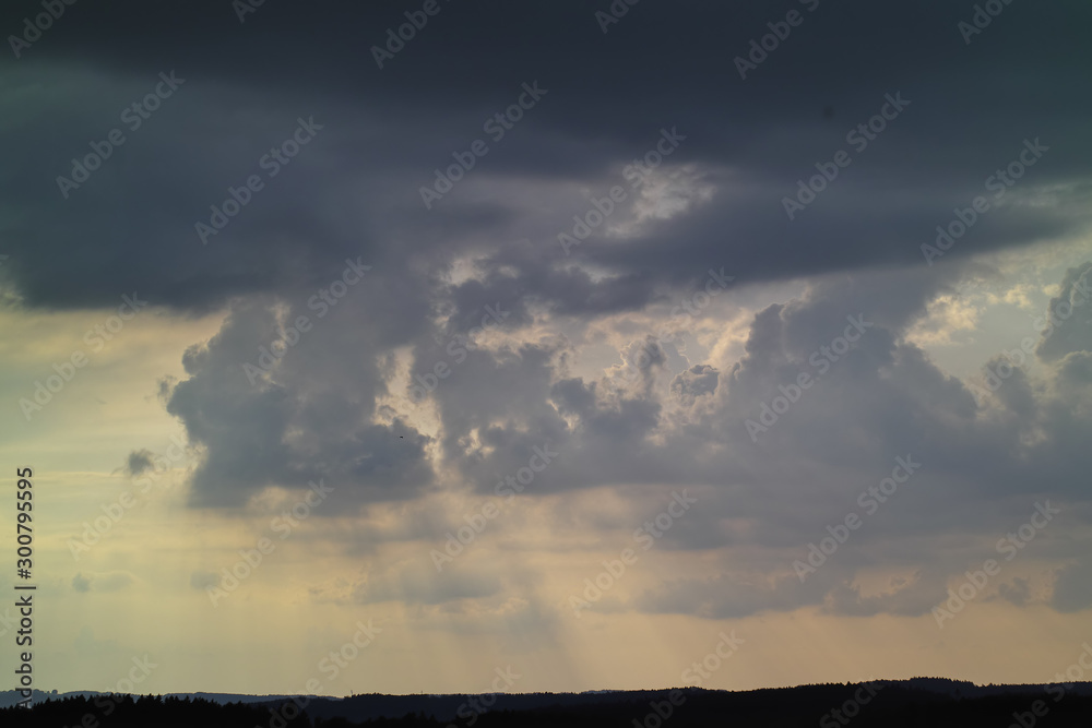 Bad weather front, thunderstorm over Upper Bavaria, storm, heavy rain and black clouds over silhouette of forest, Bavaria, Germany