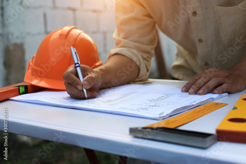 Architectural work site desk background construction project ideas concept, With drawing equipmen