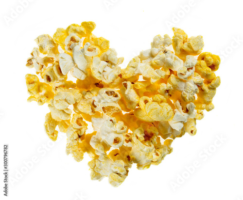 Cheese popcorn with heart shape isolated on white background,top view