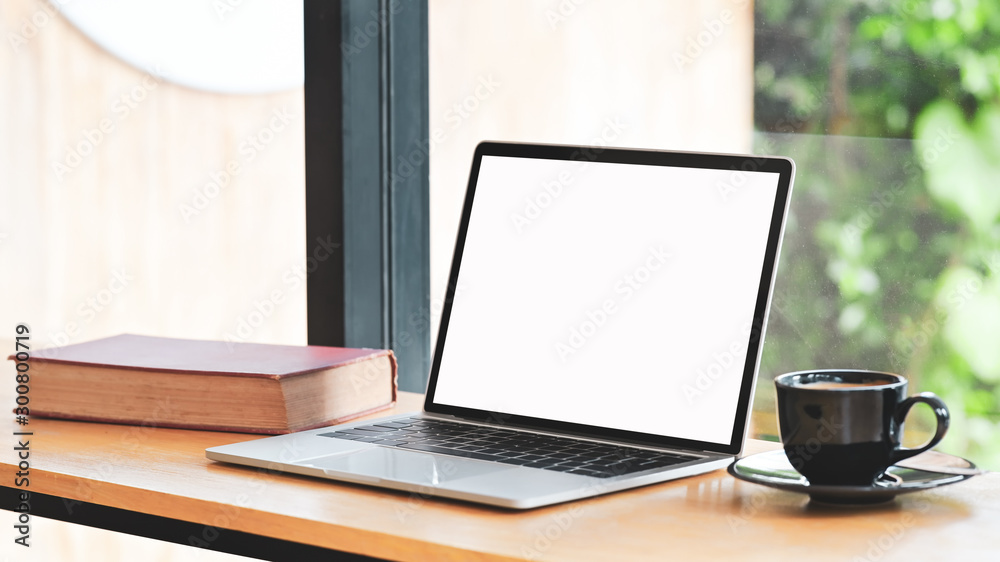 Mockup laptop computer isolated screen with book and coffee cup. Mockup laptop computer isolated screen with book and coffee cup.