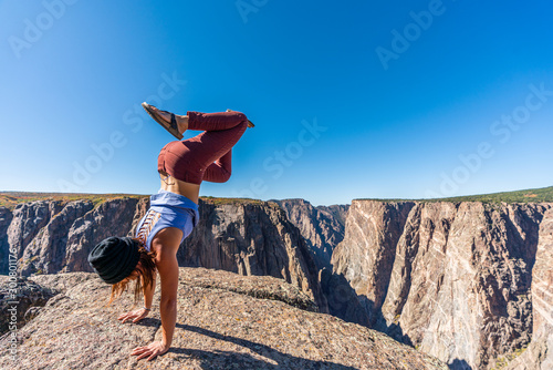 Woman Doing Handstands and Looking over the Black Canyon of the Gunnison
