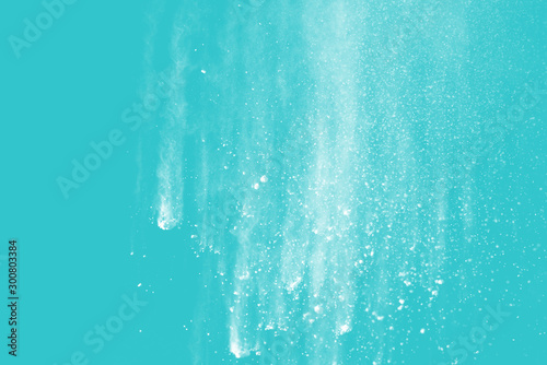 Explosion of colored powder isolated on blue background. Abstract colored background. holi festival.