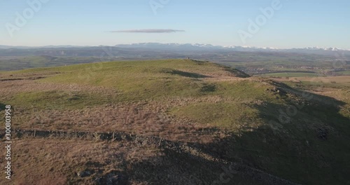 Aerial view over Scout Hill in the South Lakes looking towards crooklands in the United Kingdom with the snow covered peak of the lake district photo