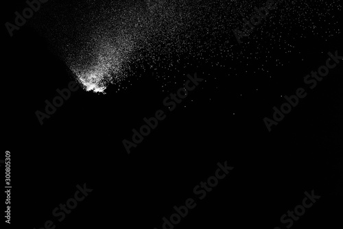 abstract white dust explosion on a black background.