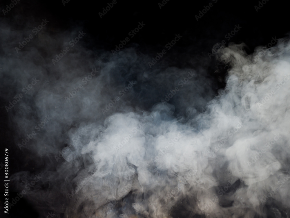 White smoke rises from below. Studio photography