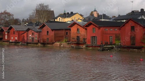 Old red barns on the banks of the Porvoonjoki river. Porvoo, Finland photo