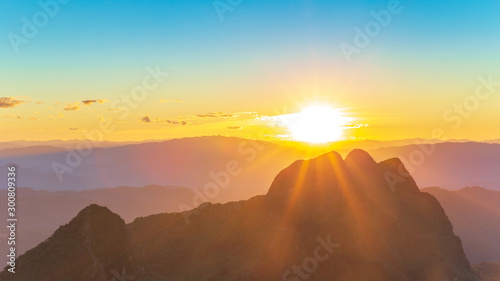 Panorama photo of Sunset or evening time with blue sky and sunray or sunbeam at Doi Luang Chiang Dao, Chaingmai, Thailand.