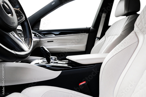 Wallpaper Mural Modern luxury car white leather interior with natural wood panel. Part of leather car seat details with stitching. Interior of prestige modern car. White perforated leather. Car detailing. Car inside Torontodigital.ca