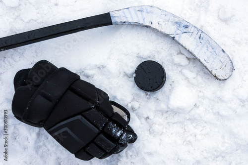 Photography hockey player lying on the snow at the stadium