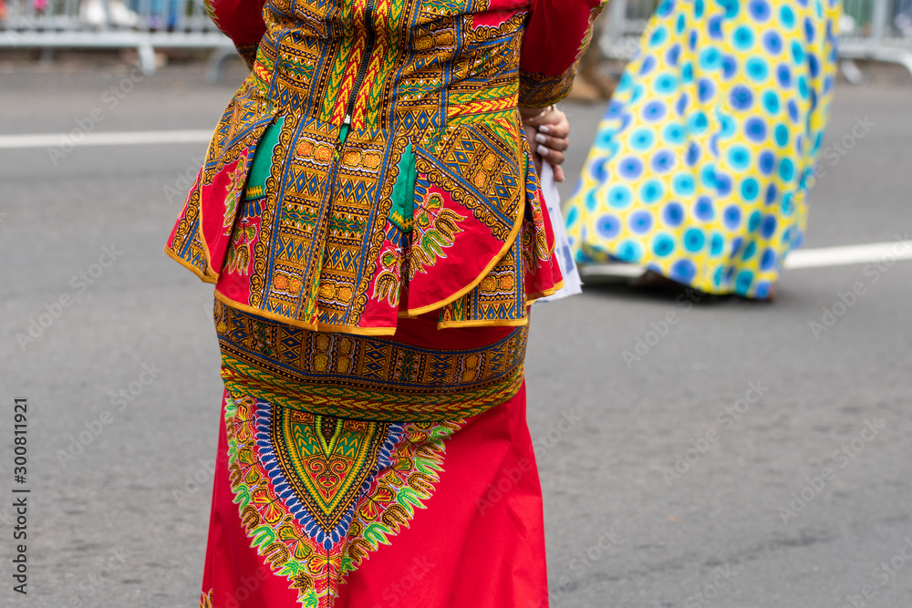 Unidentifiable woman wearing traditional African style clothing during Panama Parade celebrating Flag Day in Panama, which is November 4th. Selective focus.