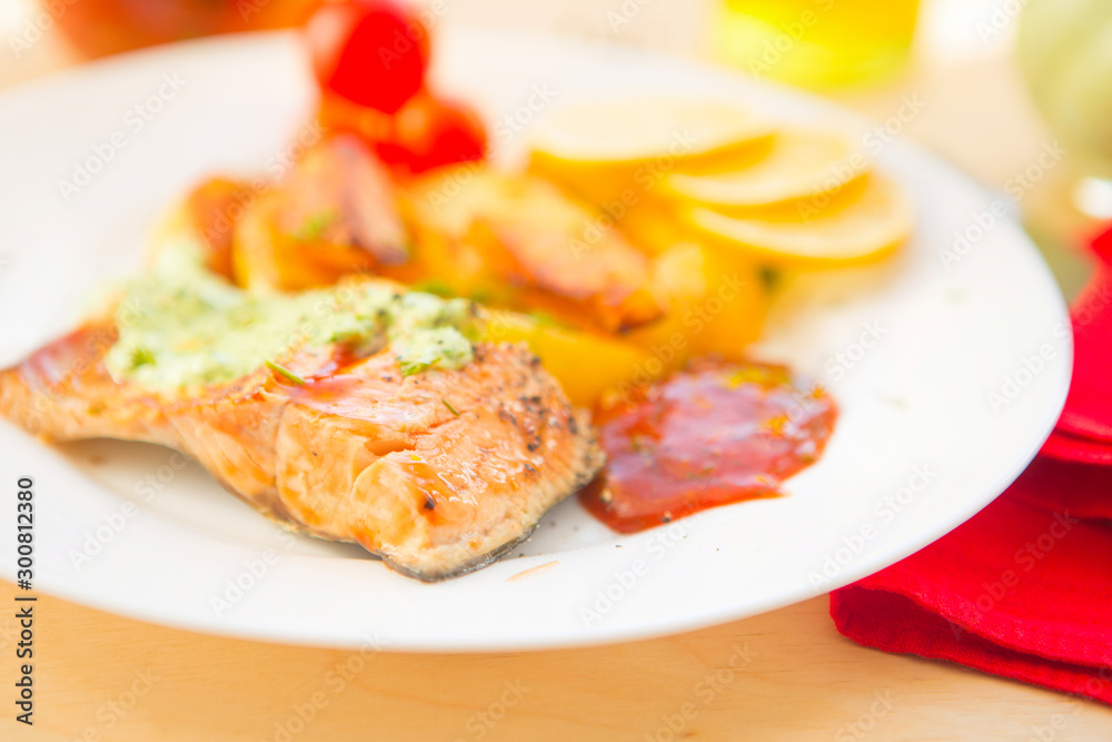 Baked salmon with potatoes and cream sauce