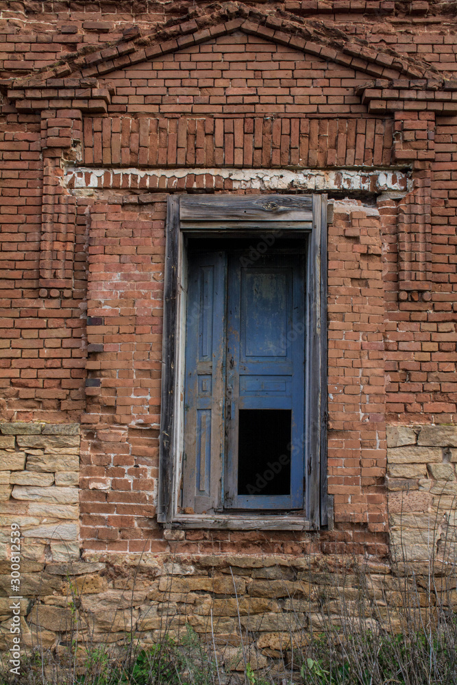 old window in brick wall