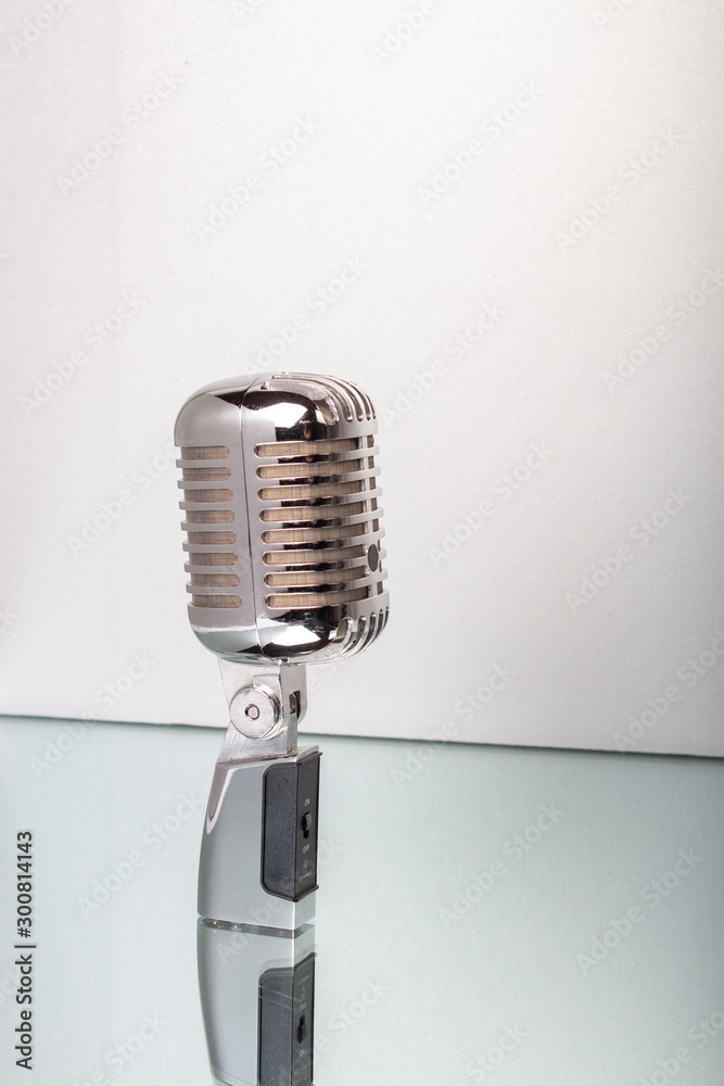 Fototapeta premium Retro microphone isolated on white background. Music and karaoke.