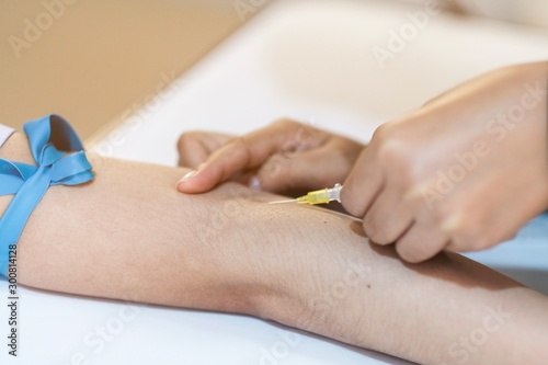 A nurse inserted needle in to the patient for chemotherapy