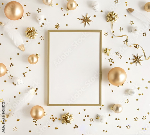 Christmas background . Xmas or new year gold white decorations and gold frame mock up on white background with empty copy space for text.  holiday concept for postcard or invitation. top view 