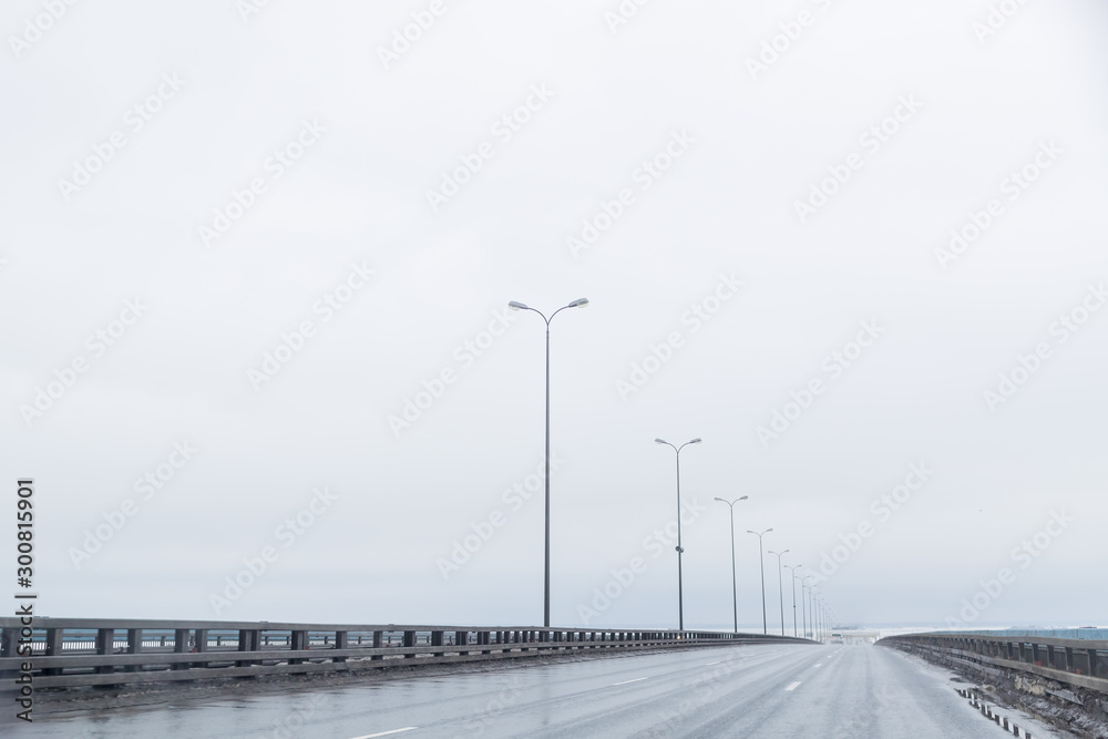 industrial and transport concept of empty free European highway between mountains scenery landscape in cloudy and rainy weather.rainy road without cars,strong wind. Bad weather and harsh conditions of