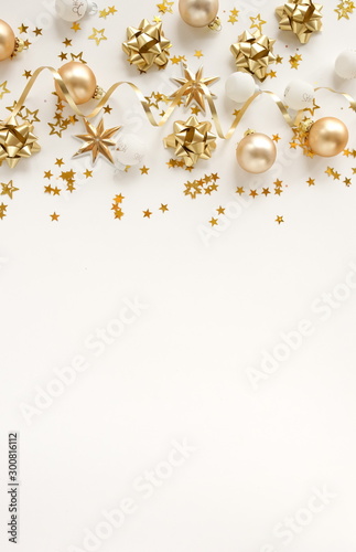 Christmas background. Xmas or new year gold white decorations on white background top view. holiday and celebration concept for postcard or 
