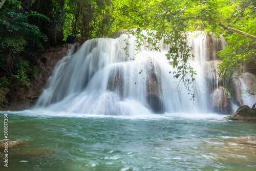 Wonderful green waterfall and nice for relaxation  Breathtaking and amazing turquoise water at the evergreen forest  Located Erawan waterfall Khanchanaburi Province  Thailand