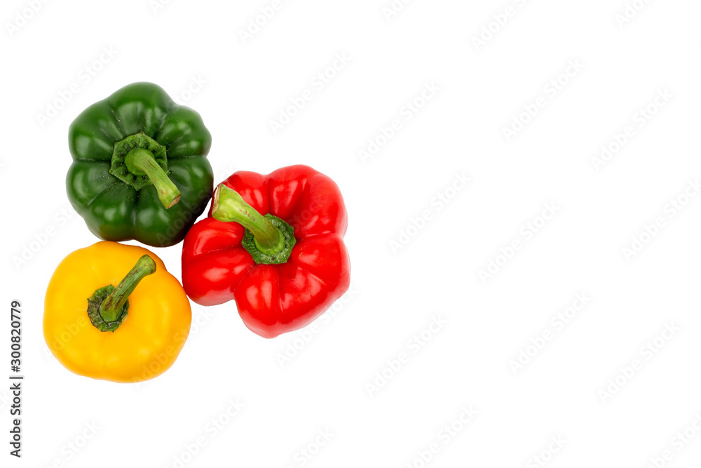 Green, red and yellow bell peppers on isolated backgrounds Green, red and yellow bell peppers on isolated backgrounds