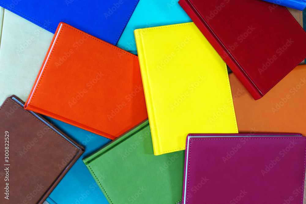 Books with Colorful Book Covers Scattered on Shelf, Top View. Abstract Background Books with Colorful Book Covers Scattered on Shelf, Top View. Abstract Background