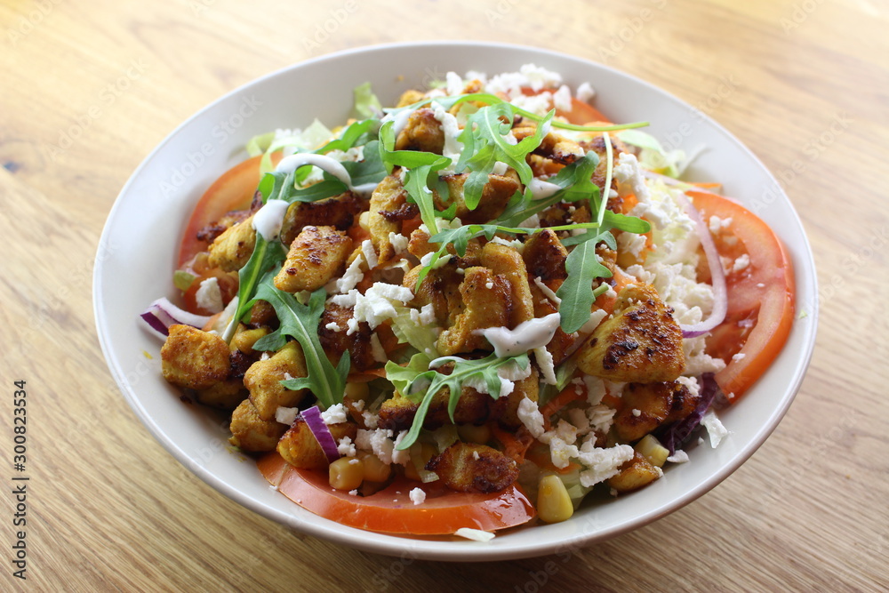 Delicious chicken salad in a white plate. Delicious chicken salad in a white plate.