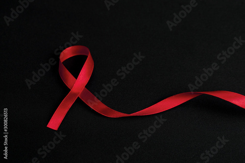 Red ribbon on palms and text 1st december world aids day, AIDS, HIV