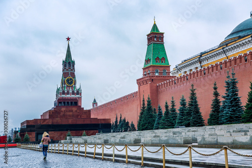 Moscow, Russia, 11/05/2019: Spasskaya Tower and the mausoleum on Red Square. Beautiful cityscape on a cloudy day.