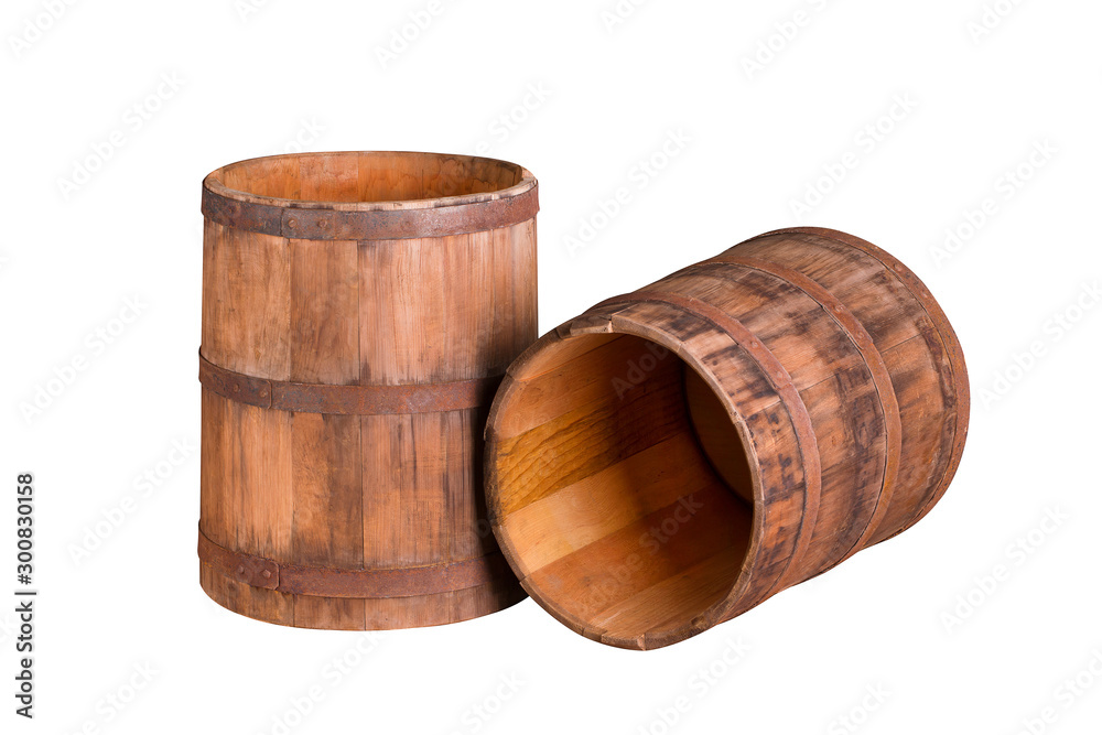 Wooden barrels close-up. Two old wooden barrels isolate on a white background. Wooden barrels close-up. Two old wooden barrels isolate on a white background.