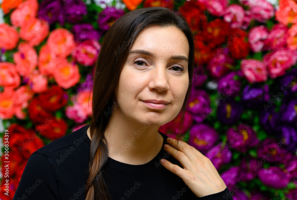 Portrait of an adult woman without makeup with clean skin, with long brown face hair on a colored background. The concept of age-related cosmetics, facial skin healing. Portrait of an adult woman without makeup with clean skin, with long brown face hair on a colored background. The concept of age-related cosmetics, facial skin healing.