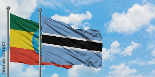 Ethiopia and Botswana flag waving in the wind against white cloudy blue sky together. Diplomacy concept, international relations.