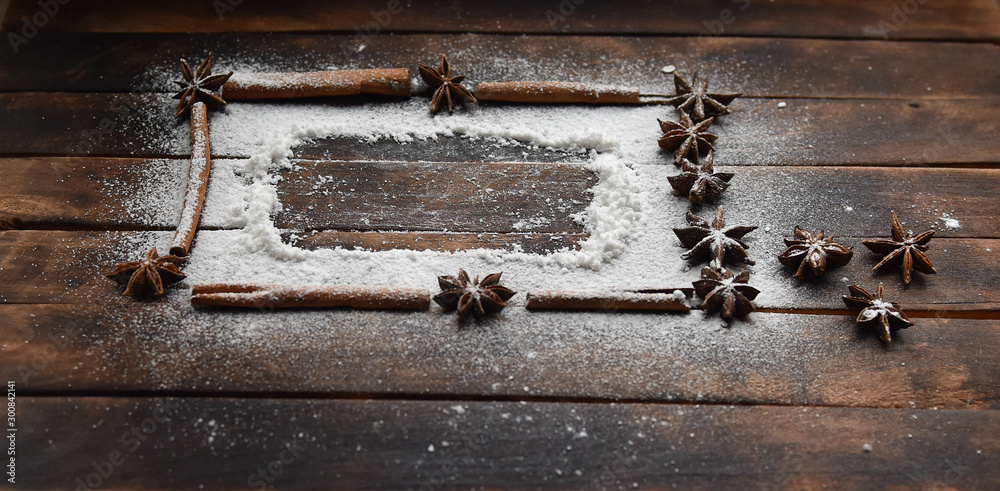 cinnamon stick frame stars star anise icing sugar for Christmas decor