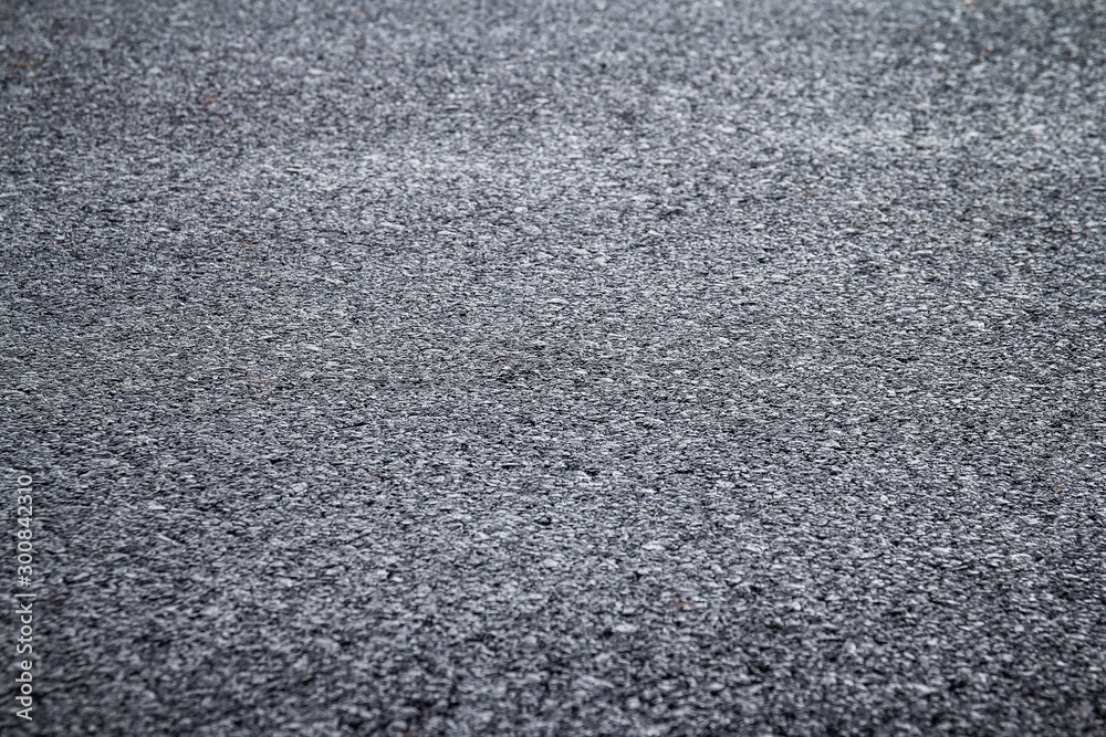 close up of new asphalt road texture with selective focus close up of new asphalt road texture with selective focus