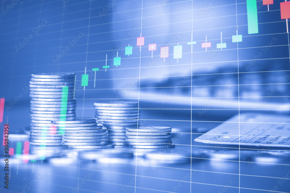 Stack of money coin with trading graph, financial investment concept use for background Stack of money coin with trading graph, financial investment concept use for background