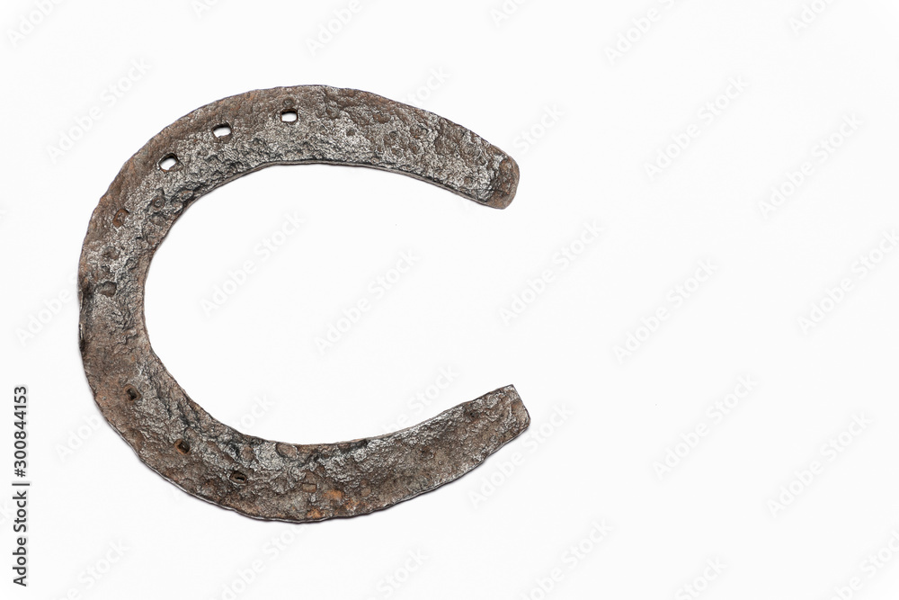 Isolated rustic Horseshoe top, resting on its side, isolated on a white background. Isolated rustic Horseshoe top, resting on its side, isolated on a white background.