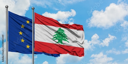 European Union and Lebanon flag waving in the wind against white cloudy blue sky together. Diplomacy concept, international relations.