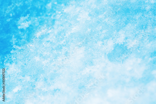 Winter christmas background. Snowflakes in the soft white snow. Winter background.