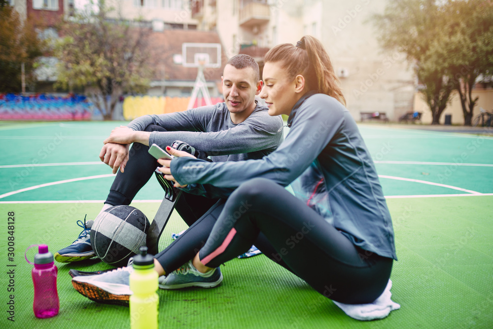 Young man with prosthetic leg enjoying with his friend at basketball court. Young man with prosthetic leg enjoying with his friend at basketball court.