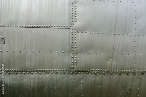 Aluminum sheet and rivet fastening. Aviation background.