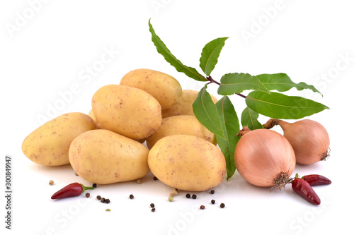 Raw potatoes, fresh laurel, onions  and pepper isolated on a white background. 