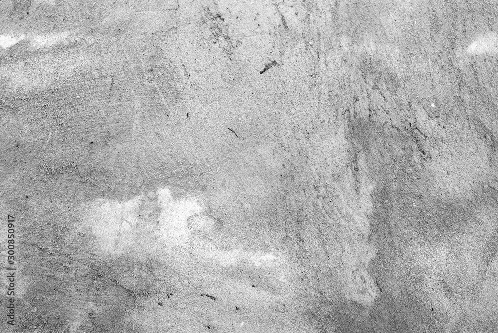 Fototapeta premium Texture of a concrete wall with cracks and scratches which can be used as a background