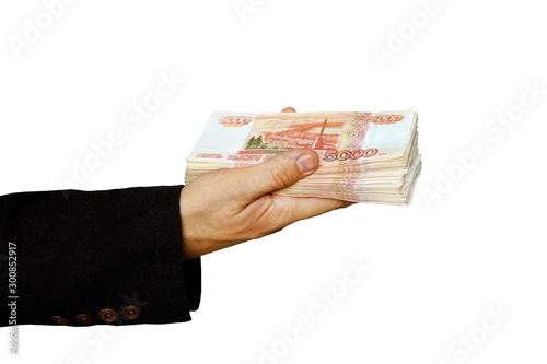 banknote 5000 rubles in men hand isolated on white background. photo