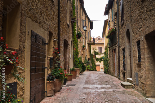 Narrow streets with romantic medieval architecture at city of Pienza, Siena province, Tuscany, Italy