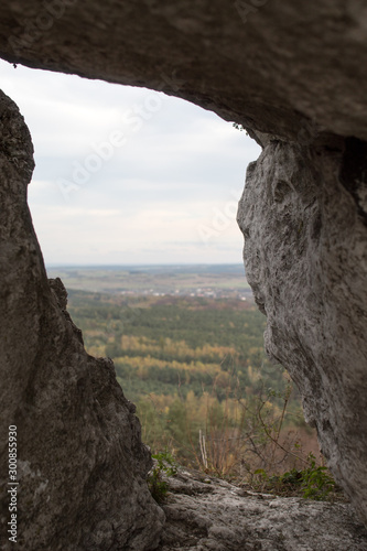 Vertical mountain landscape of limestone cliffs against a blue sky. The Zborow Massif in Central Poland on the Krakow-Czestochowa Upland photo