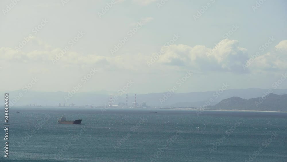 Seascape with Working Cargo Ships and Thermal Power Plant in Morning At Dawn.