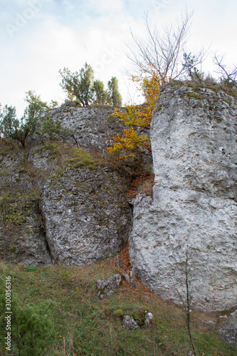 Vertical mountain landscape of limestone cliffs against a blue sky. The Zborow Massif in Central Poland on the Krakow-Czestochowa Upland photo