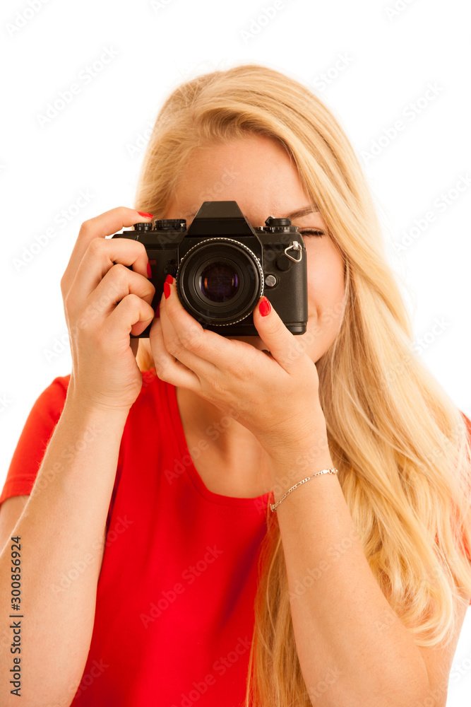 Woman in red with a retro camera isolated over white background Woman in red with a retro camera isolated over white background